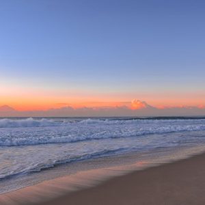Beach Scenery - Peaceful beach scene at sunrise with gentle wave #16354140